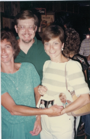 Exchanging baby photos.. Anna, Ed and Jane